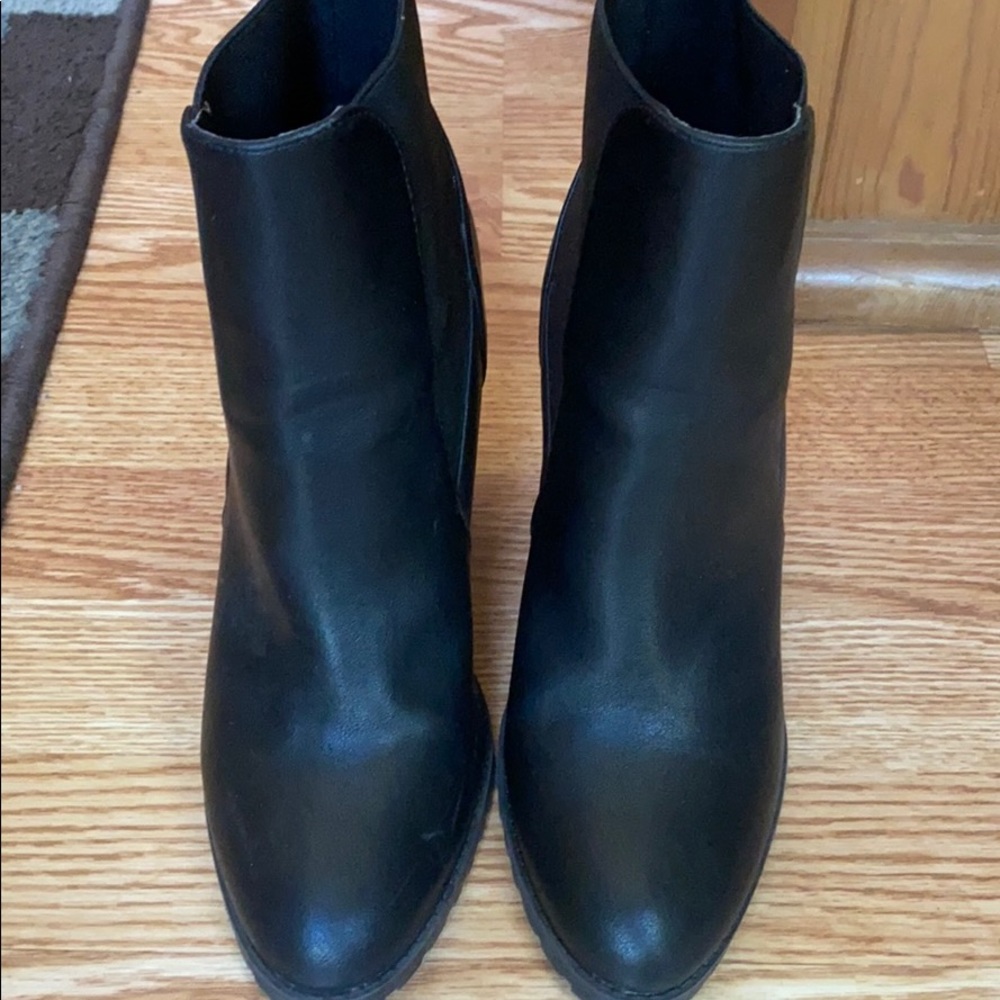 Black slip on high heel , short boots.